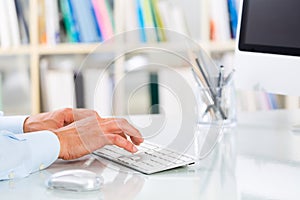 Businessman's Hands Typing on Keyboard