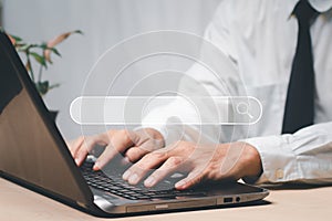 businessman's hands are using a computer keyboard to Searching for information data. The concept is Technology Search Engine