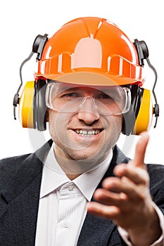 Businessman in safety hardhat helmet gesturing hand greeting or