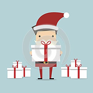 Businessman Santa holding a big gift box