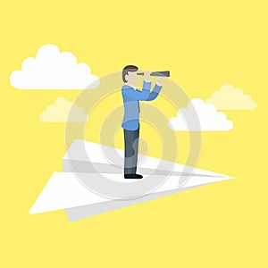 Businessman scanning the business landscape with telescope.