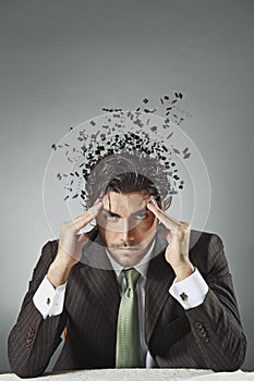Businessman with scattered mind photo