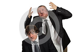 Businessman screaming and fighting at a young colleague