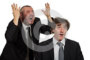 Businessman screaming and fighting at a young colleague