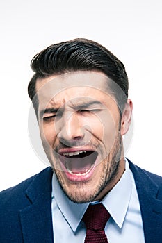 Businessman screaming isolated on a white background