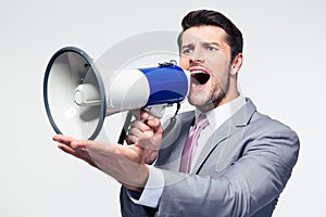 Businessman screaming in megaphone