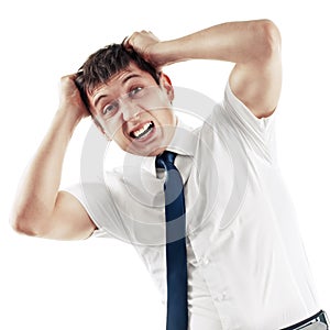 Businessman screaming and pulling his hair