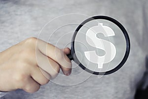 Businessman search loupe magnifier dollar icon