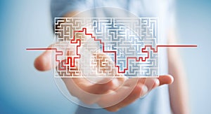 Businessman searching solution of a complicated maze