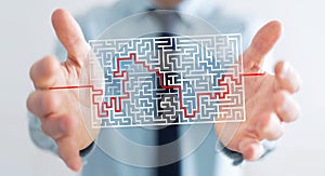 Businessman searching solution of a complicated maze