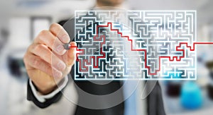 Businessman searching solution of a complicated maze