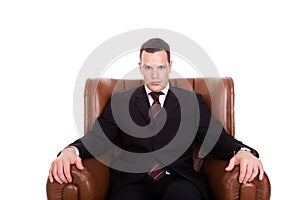 Businessman seated on a chair