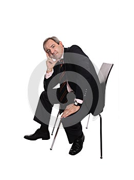 Businessman seated on a chair