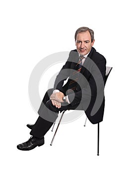 Businessman seated on a chair photo
