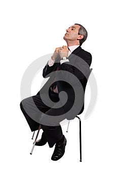 Businessman seated on a chair