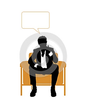 Businessman seated in orange armchair and thinking