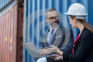 Businessman and Secretary work at Container cargo site check up goods in container. Manager and  customer checking on shipping con