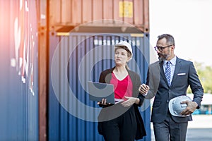 Businessman and Secretary work at Container cargo site check up goods in container. Manager and  customer checking on shipping con