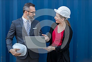 Businessman and Secretary work at Container cargo site check up goods in container. Manager and  customer checking on shipping con