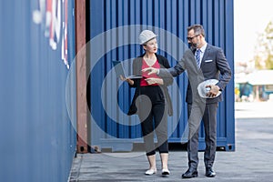 Businessman and Secretary work at Container cargo site check up goods in container. Manager and  customer checking on shipping con