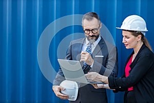Businessman and Secretary work at Container cargo site check up goods in container. Manager and customer checking on shipping cont