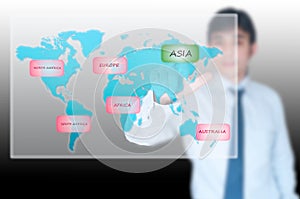 Businessman selecting Asia button