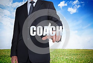 Businessman selecting coach word