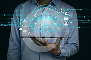 A businessman selects a lock icon on a virtual display. Internet network security concept, website connection. to prevent hackers