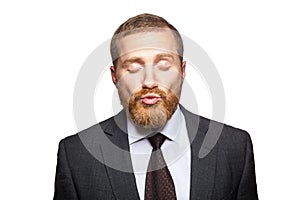 Businessman send kiss with clossed eyes.