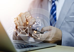 Businessman sending a letter from a computer. electronic mail concept is online communication on the Internet network Receiving