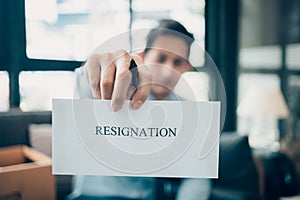 Businessman sending and showing resignation letter to employer boss. Quiting a job, businessman fired or leave a job concept