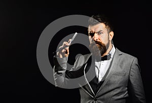 Businessman with serious face isolated on black background