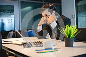 Businessman serious about the  work hard done until the headache