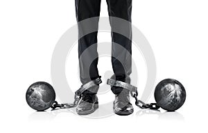 Businessman shackled in the iron ball and chain