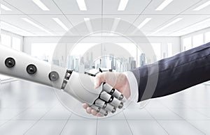 Businessman shake hand with machine or robot