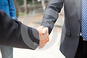 Businessman shake hand to celebrate success and business deal.