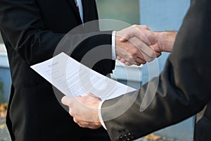 Businessman Shaking Hands With Partner