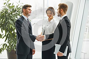 Businessman shaking hands. People shake hands communicating with photo