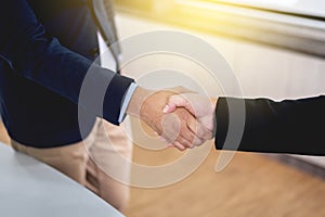 Businessman shaking hands to make business dealing