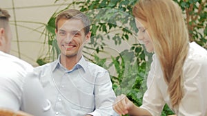 The businessman shook hands with the colleagues