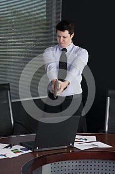 Businessman shooting laptop