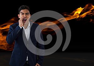 Businessman shouting with fire