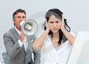 Businessman shouting through a megaphone