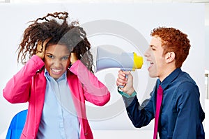 Businessman shouting megaphone to african woman