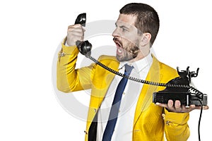 Businessman shouting into the phone handset, nerves exploded