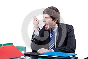 Businessman shouting to phone
