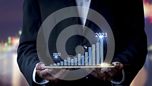 Businessman show stock market bar chart grow up to target. Business finance concept. Businessman`s hands Show success graph,