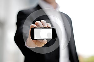 Businessman showing black mobile smart phone in hand