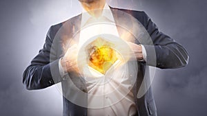 Businessman showing a burning heart