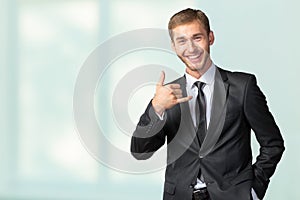 Businessman showing Call me sign